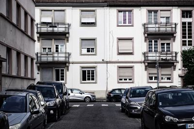 Cars parked on street in city