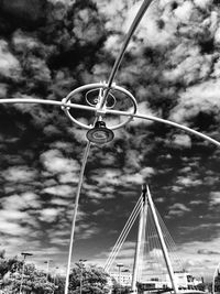 Low angle view of overhead cable car against sky