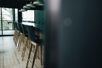 Empty chairs and table in room