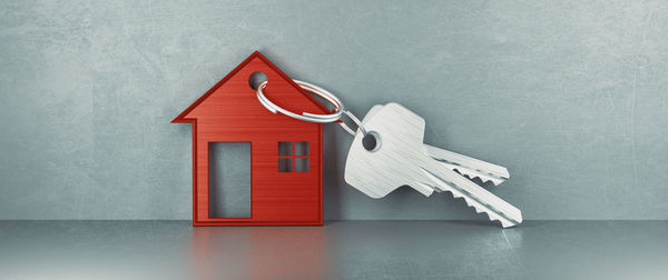 Close-up of red house against white background