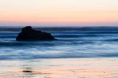 Scenic view of sea at sunset