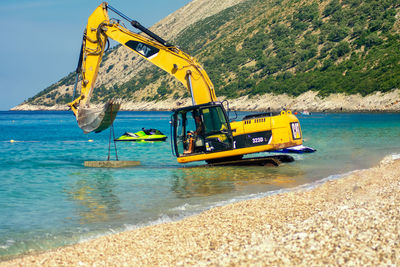 View of yellow ship in sea
