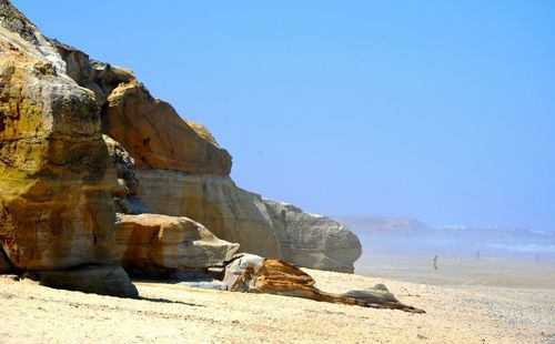 Scenic view of mountains against clear blue sky