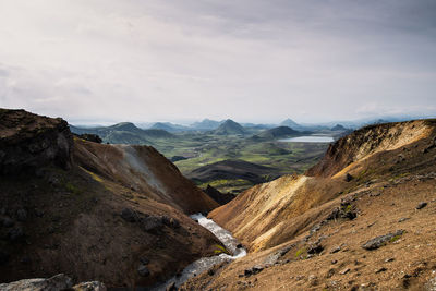 View of mountain range against cloudy sky