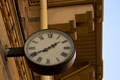 Low angle view of clock on building