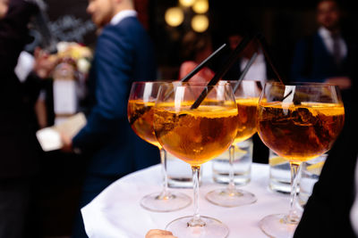 People in glass on table at restaurant