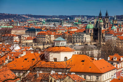 Charles bridge and prague city old town seen from petrin hill in a beautiful early spring day
