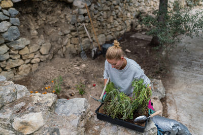 Woman working in the garden planting plants