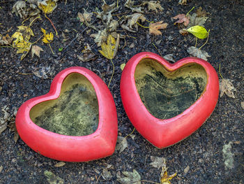 High angle view of heart shape on rock