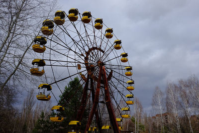 Low angle view of ferris wheel against sky