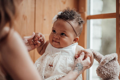 Portrait of mother and daughter at home