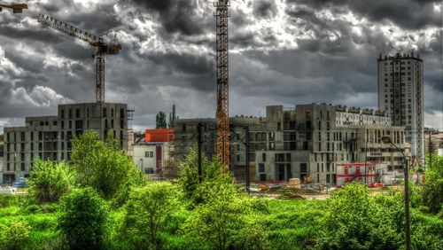 View of buildings against cloudy sky