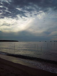 Scenic view of sea against cloudy sky