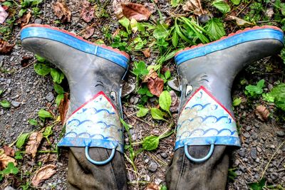 Low section of shoes on ground