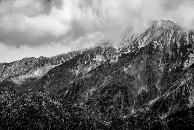 Scenic view of snowcapped mountains against sky