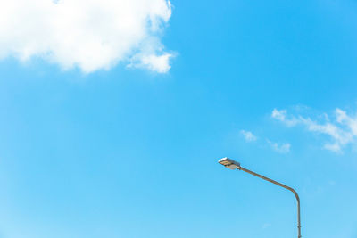 Low angle view of street light against sky