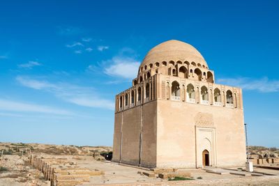 View of historical turkmenistan  building against blue sky