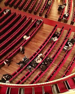 High angle view of people sitting in auditorium