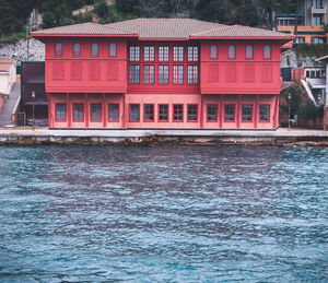 Red building by river
