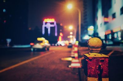 Illuminated city street at night