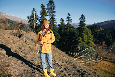 Full length of woman standing on field