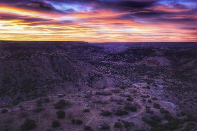 Scenic view of landscape against sky during sunset