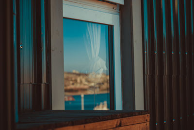 Reflection of window on glass door