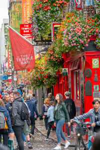 Group of people walking on city street