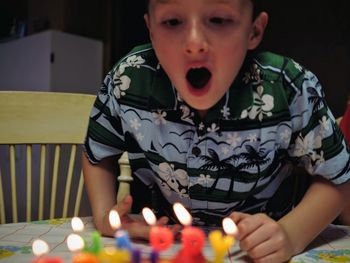 Boy blowing birthday candles