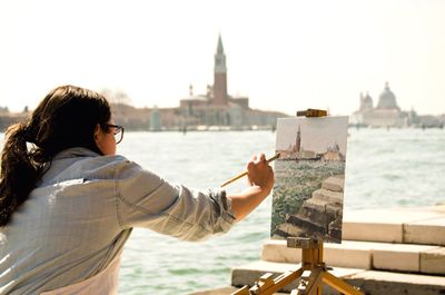 Woman looking at river