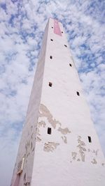 Low angle view of historical building against cloudy sky