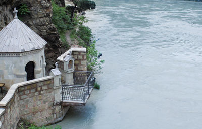 High angle view of built structure by lake