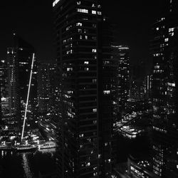 Modern buildings in city at night