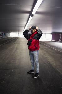 Rear view of man standing in bus