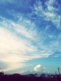 Scenic view of mountains against cloudy sky