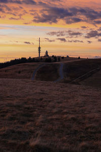 Scenic view of field against sky during sunset