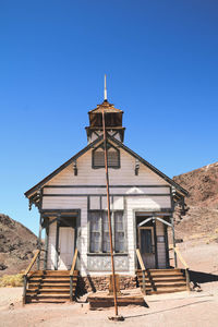 Exterior of old building against clear blue sky