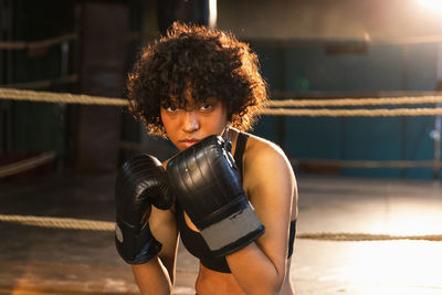 Portrait of young woman standing in gym