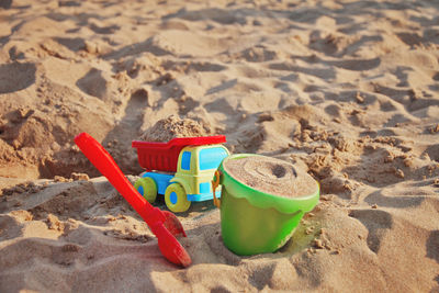 Close-up of toys on beach