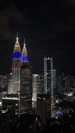 Illuminated buildings in city at night