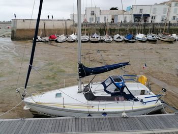 Boats moored at harbor