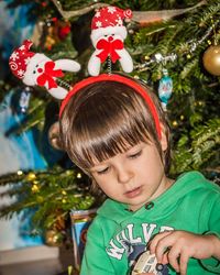 Portrait of boy with christmas tree