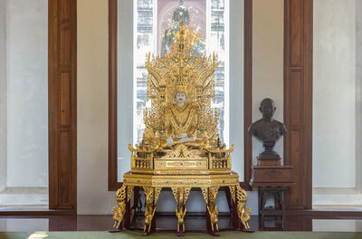 Statue in temple against building