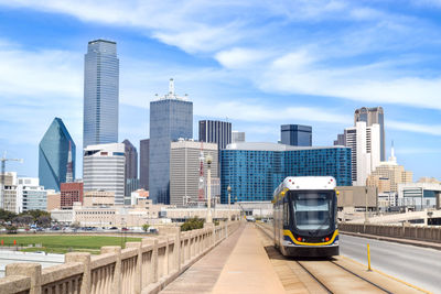 View of modern buildings in city against sky