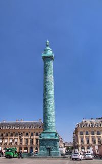 Low angle view of column against clear sky at place vendome in city