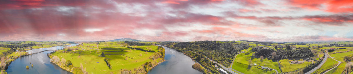 Panoramic view of land and mountains against sky