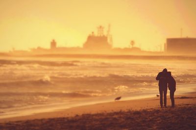 Silhouette of woman at sunset