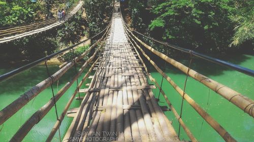 High angle view of footbridge over plants