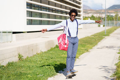 Portrait of man skateboarding outdoors