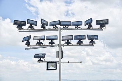 Low angle view of information sign against sky